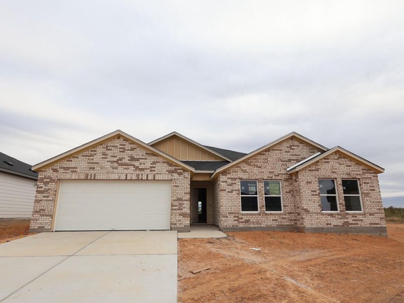Front exterior of a new home in Carillon, Manor, TX, highlighting curb appeal (Image 2). Front exterior of a new home in Carillon, Manor, TX, highlighting curb appeal (Image 2).