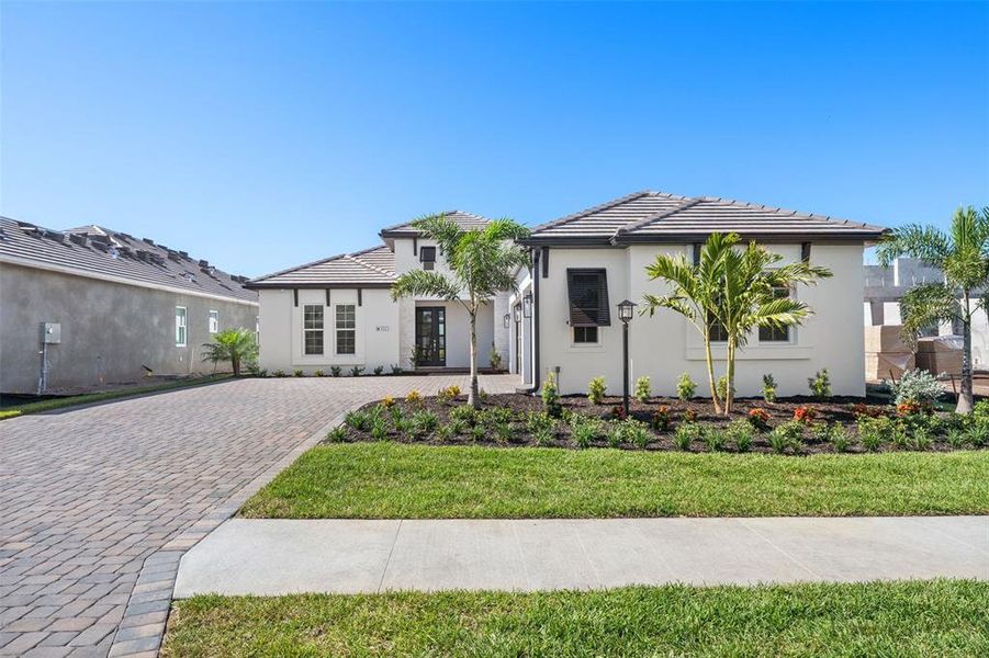 Front exterior of a new home in , Sarasota, FL, highlighting curb appeal (Image 32).