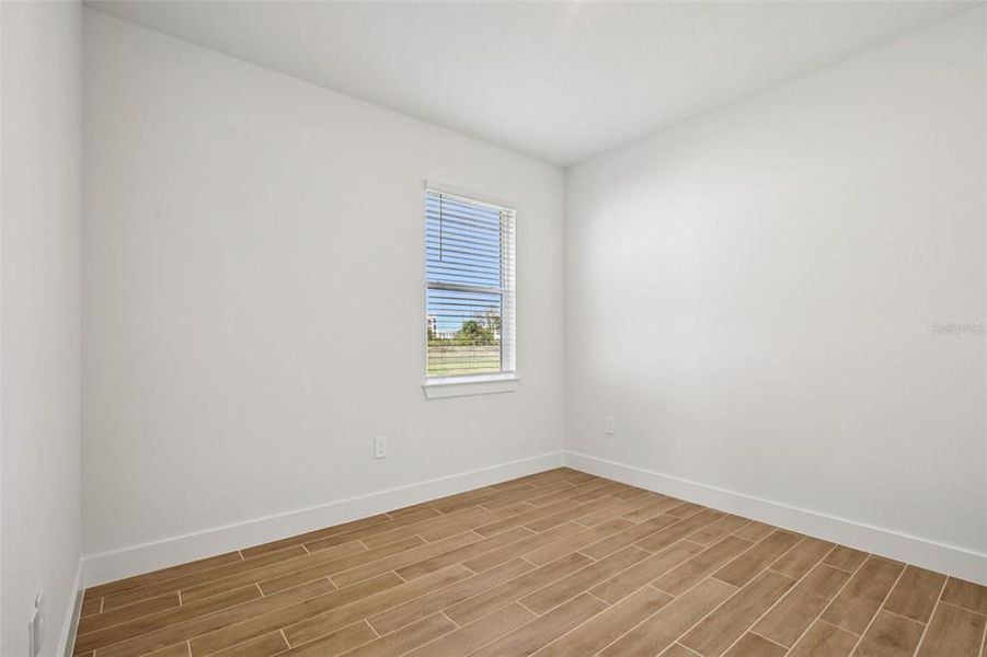 Spacious, unfurnished interior of a new home in Magnolia Bay - Reserve Series, Nokomis (Image 18).