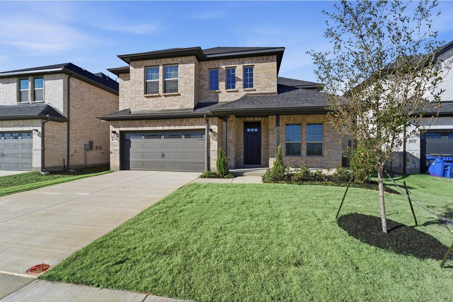 Front exterior of a new home in La Terra, Celina, TX, highlighting curb appeal (Image 2). Front exterior of a new home in La Terra, Celina, TX, highlighting curb appeal (Image 2).