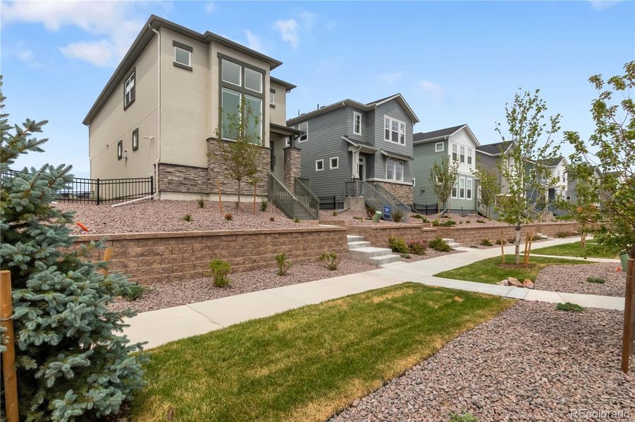 Front exterior of a new home in , Colorado Springs, CO, highlighting curb appeal (Image 24).