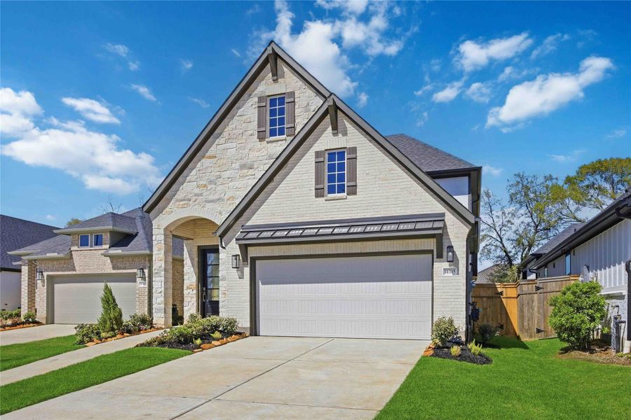 Front exterior of a new home in Sienna, Missouri City, TX, highlighting curb appeal (Image 8).