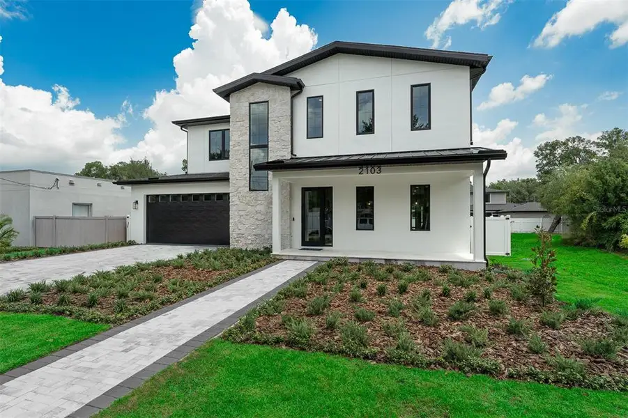 Front exterior of a new home in , Orlando, FL, highlighting curb appeal (Image 30).