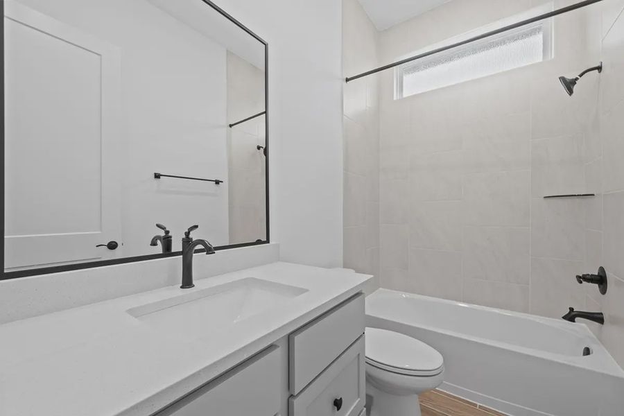Representative furnished interior of a home built from the Summerton by Chesmar Homes in University Heights, Round Rock (Image 5).