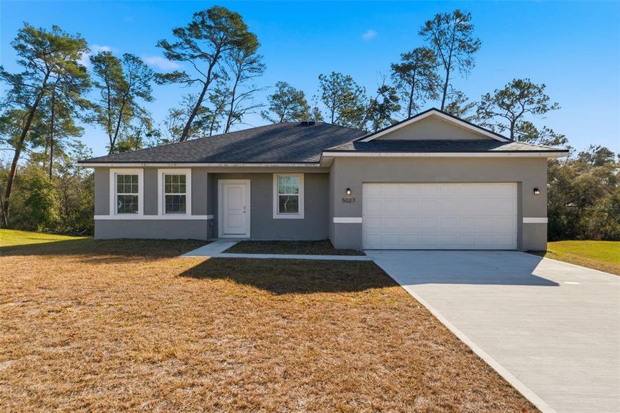 Front exterior of a new home in , Ocala, FL, highlighting curb appeal (Image 22).
