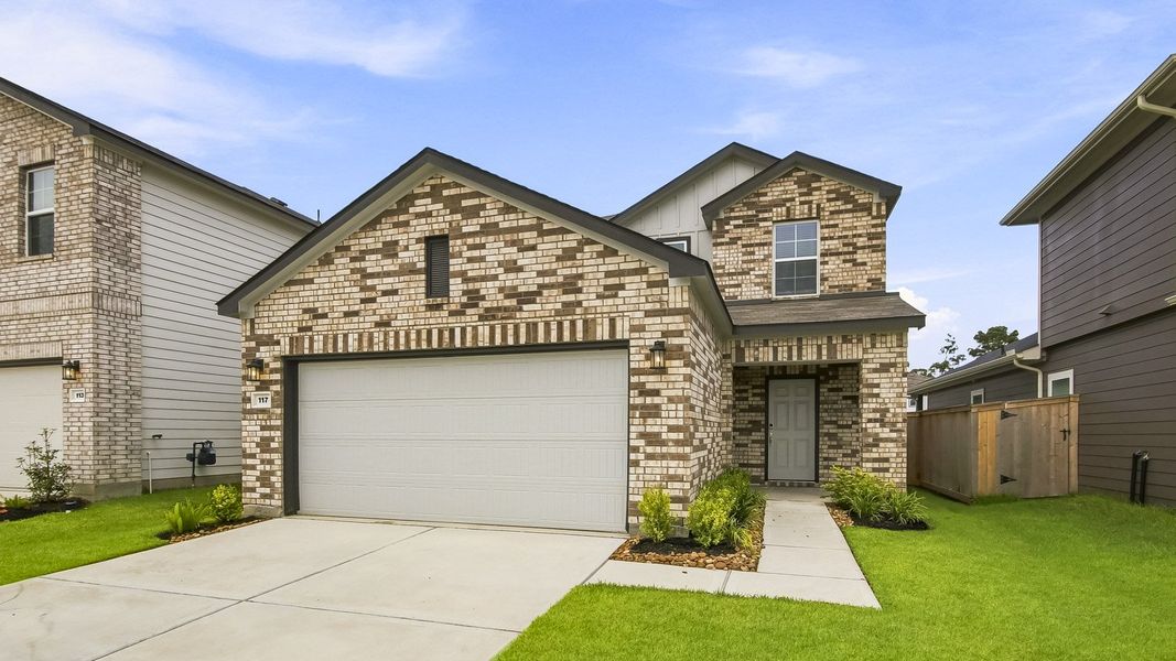 Front exterior of a new home in Maple Woods, Hockley, TX, highlighting curb appeal (Image 2). Front exterior of a new home in Maple Woods, Hockley, TX, highlighting curb appeal (Image 2).