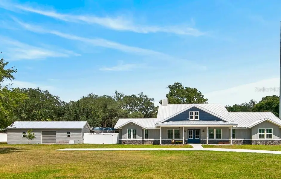 Front exterior of a new home in , Hudson, FL, highlighting curb appeal (Image 24). Front exterior of a new home in , Hudson, FL, highlighting curb appeal (Image 24).