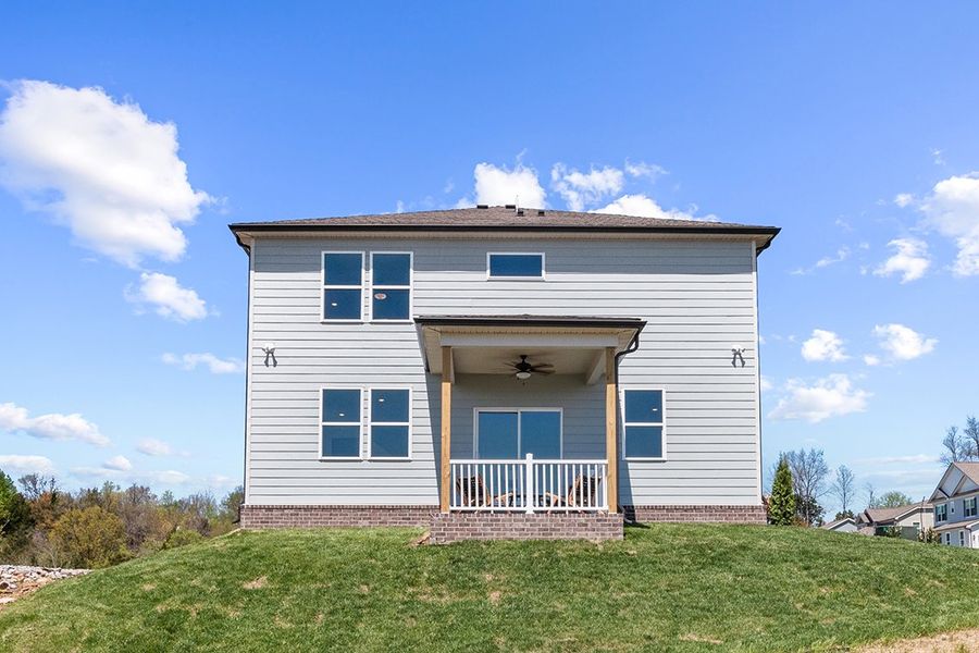 A house with a grass yard.