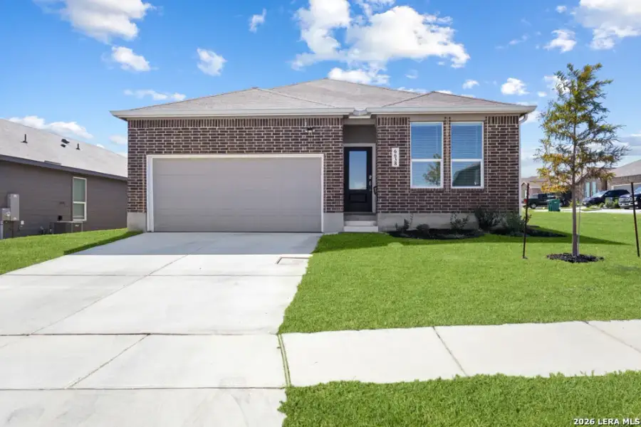 Front exterior of a new home in Hightop Ridge, Converse, TX, highlighting curb appeal (Image 26).