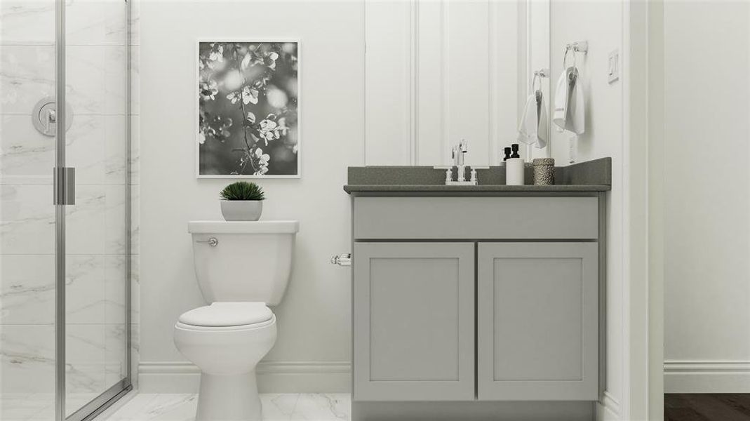 Bathroom with vanity, toilet, and an enclosed shower