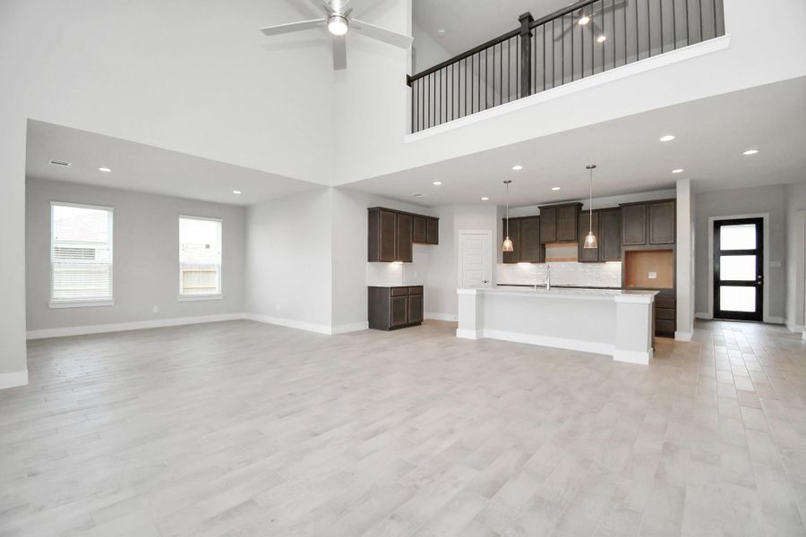 Additional view of the open and bright kitchen met by the family room. Sample photo of completed home with similar floor plan. Actual colors and selections may vary. Additional view of the open and bright kitchen met by the family room. Sample photo of completed home with similar floor plan. Actual colors and selections may vary.