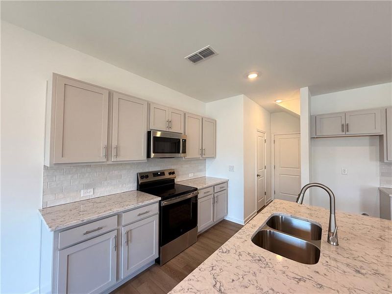 Furnished interior view inside a new home in Leydenview, Mableton (Image 30).