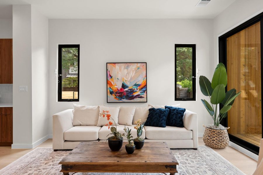 Clean lines and light hardwood floors characterize this welcoming living space. Clean lines and light hardwood floors characterize this welcoming living space.