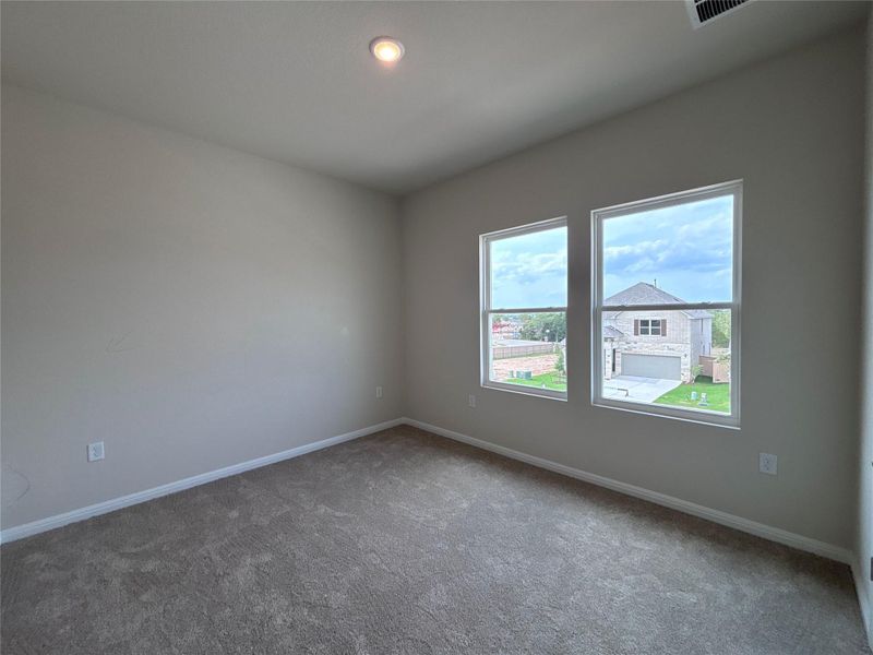 Spacious, unfurnished interior of a new home in The Colony, Bastrop (Image 10).