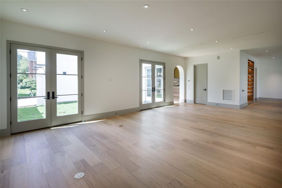Just completed and designed around the light. Multiple sets of French doors open the main living spaces to the private courtyard, while white oak floors carry seamlessly from one room to the next.