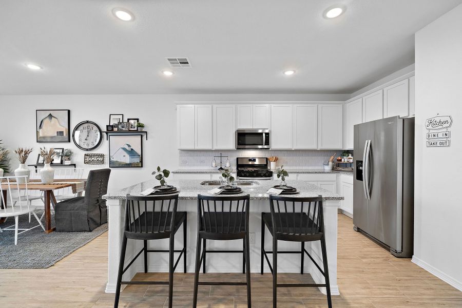 A kitchen with a large island. A kitchen with a large island.