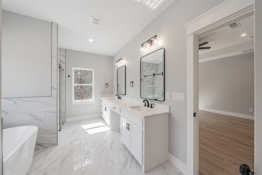 Bathroom with ceiling fan, dual bowl vanity, wood-type flooring, and independent shower and bath