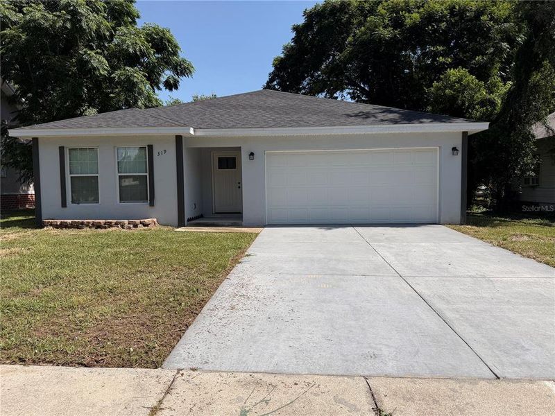 Front exterior of a new home in , Winter Haven, FL, highlighting curb appeal (Image 1). Front exterior of a new home in , Winter Haven, FL, highlighting curb appeal (Image 1).