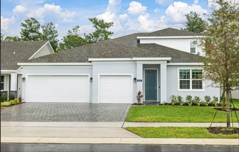 Front exterior of a new home in Trinity Gardens, Deland, FL, highlighting curb appeal (Image 1). Front exterior of a new home in Trinity Gardens, Deland, FL, highlighting curb appeal (Image 1).