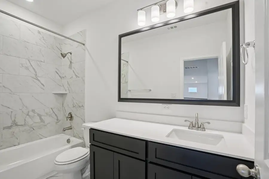 Furnished interior view inside a new home in Del Bello Lakes 60', Manvel (Image 14).