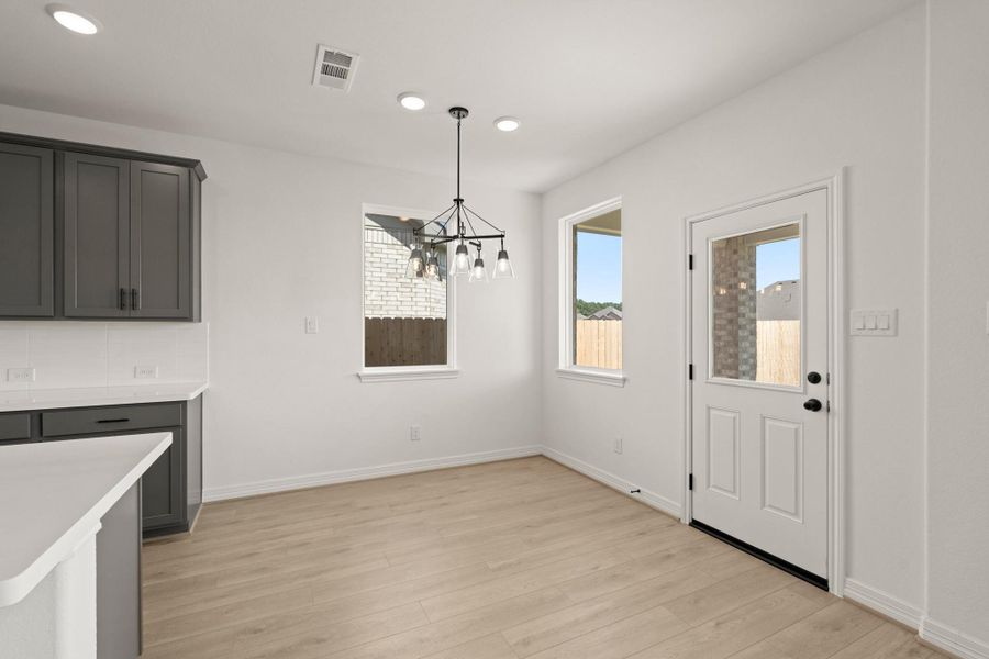 With an abundance of natural light streaming through the windows, the breakfast nook is bathed in a sunny glow, creating the perfect atmosphere to enjoy your morning coffee or a family breakfast. With an abundance of natural light streaming through the windows, the breakfast nook is bathed in a sunny glow, creating the perfect atmosphere to enjoy your morning coffee or a family breakfast.