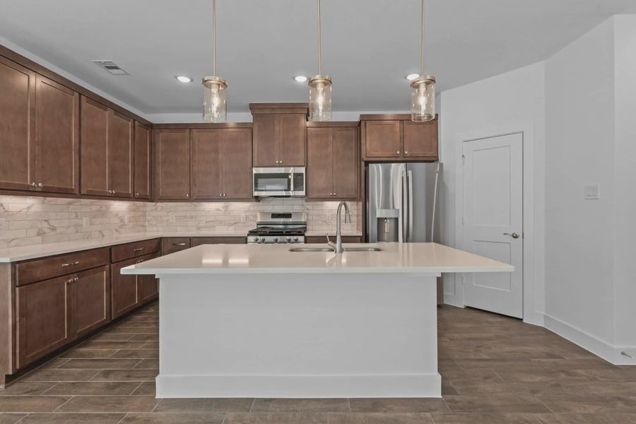 Representative furnished interior of a home built from the Carriagehouse by Chesmar Homes in Meridiana Townhomes, Iowa Colony (Image 15).