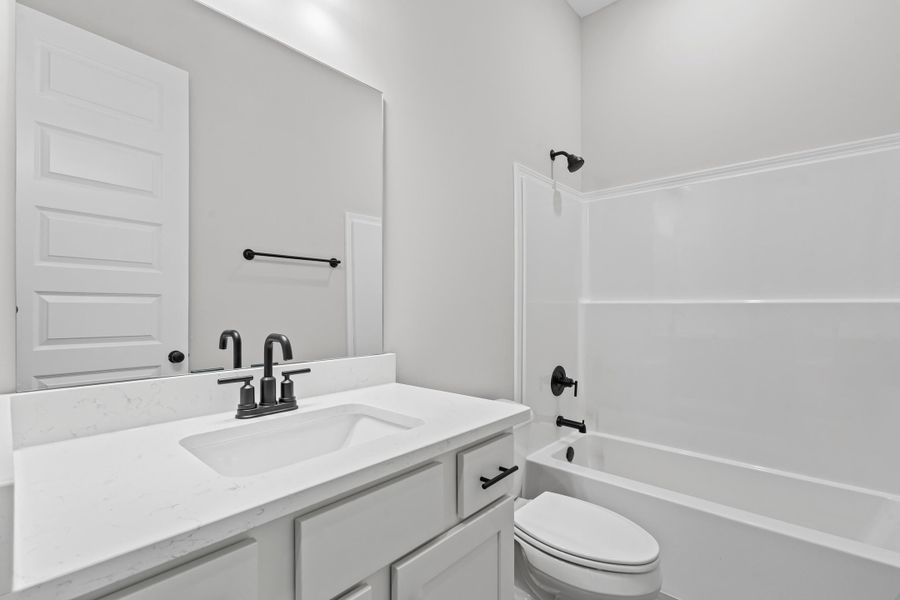 Full bath featuring shower / bath combination and vanity Full bath featuring shower / bath combination and vanity