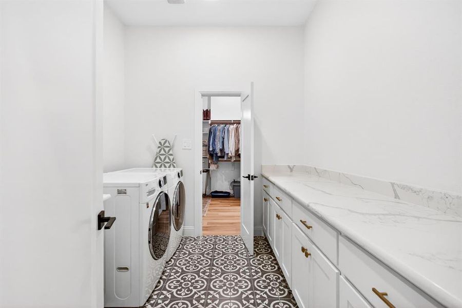 Laundry area with washing machine and clothes dryer and cabinet space Laundry area with washing machine and clothes dryer and cabinet space