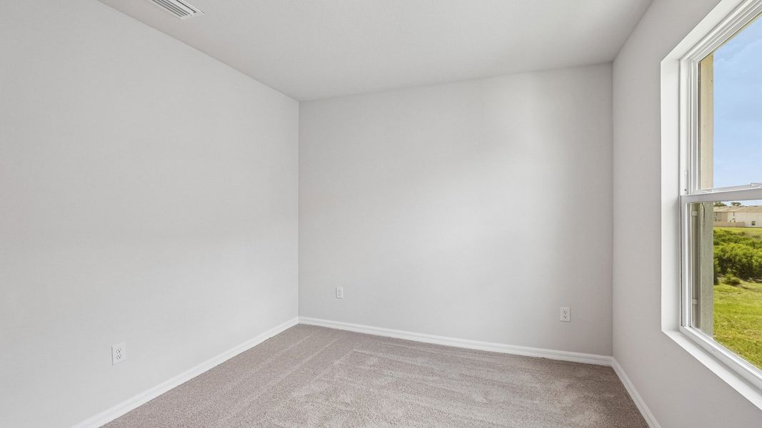 Representative unfurnished interior of a home built from the Hemingway by D.R. Horton in Silverstone North, Palmetto (Image 27).
