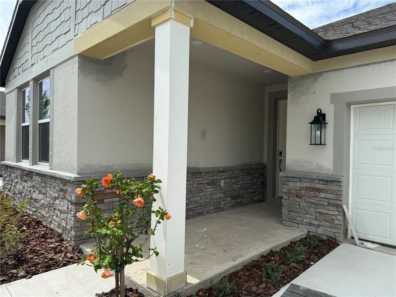 Exterior details and patio area of a home in Oakfield Trails Traditional, Parrish (Image 2).