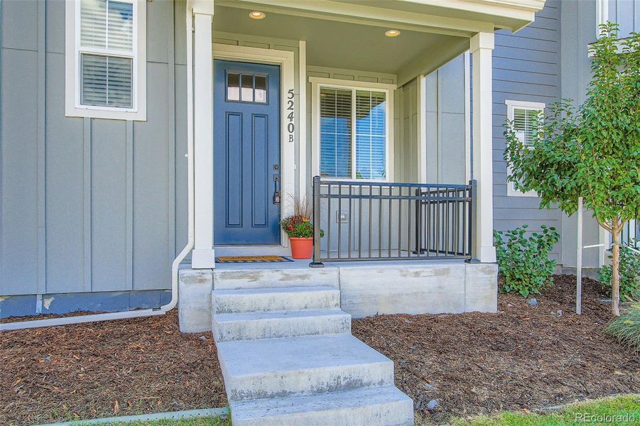 Front exterior of a new home in Haskins Station, Arvada, CO, highlighting curb appeal (Image 2).