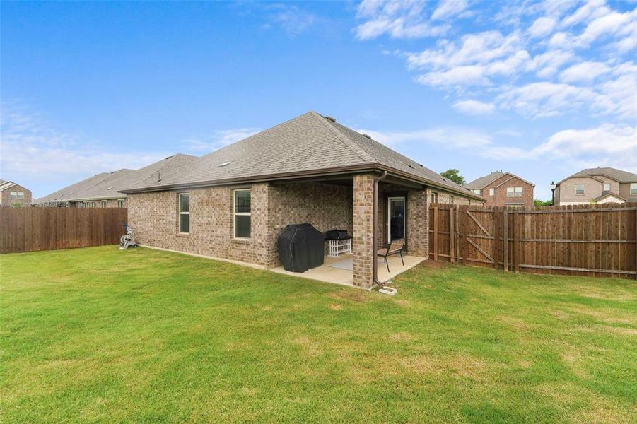Exterior details and patio area of a home in , Aubrey (Image 24).