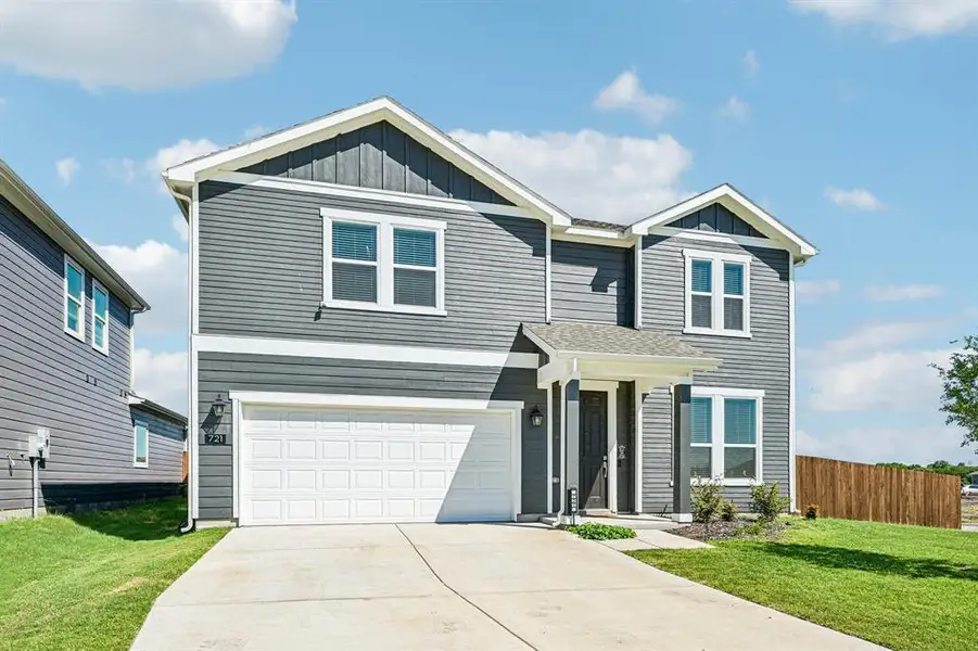 Front exterior of a new home in Cottonwood Creek, Seagoville, TX, highlighting curb appeal (Image 2). Front exterior of a new home in Cottonwood Creek, Seagoville, TX, highlighting curb appeal (Image 2).