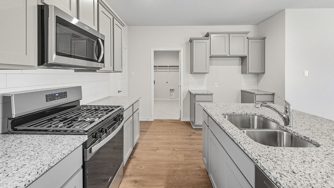 Representative furnished interior of a home built from the Finn by D.R. Horton in Windchime, Celina (Image 6).