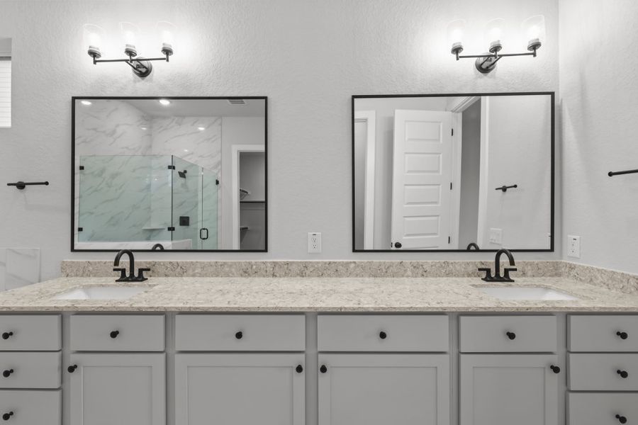 A bathroom with a large mirror. A bathroom with a large mirror.