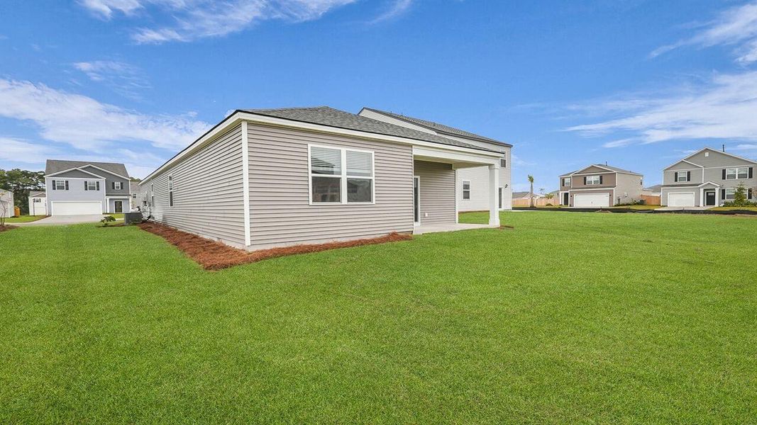 Exterior details and patio area of a home in Pine Hills at Cane Bay, Summerville (Image 17).