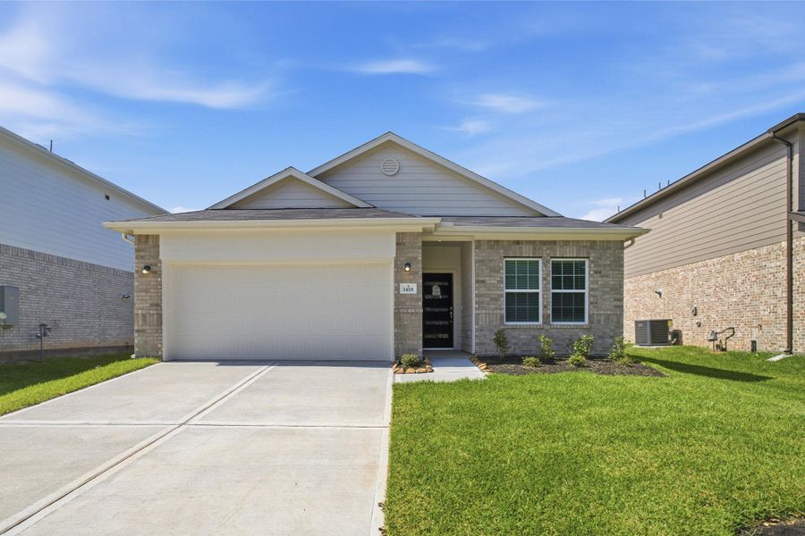 Front exterior of a new home in Steed Landing, Texas City, TX, highlighting curb appeal (Image 17). Front exterior of a new home in Steed Landing, Texas City, TX, highlighting curb appeal (Image 17).