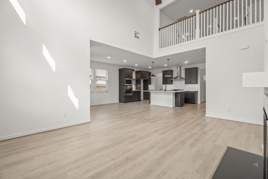 Impressive great room with high ceilings and fireplace Impressive great room with high ceilings and fireplace