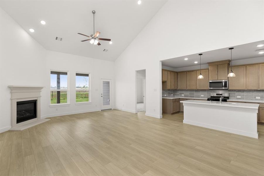 Imagine walking into a home that feels as expansive as it is inviting, bathed in natural light and framed by soaring ceilings that make every moment feel grand.