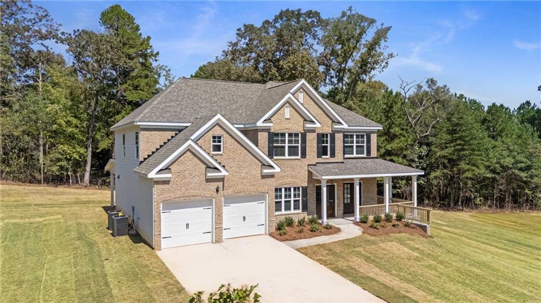 Front exterior of a new home in The Landing at Miller’s Ferry, Adairsville, GA, highlighting curb appeal (Image 2). Front exterior of a new home in The Landing at Miller’s Ferry, Adairsville, GA, highlighting curb appeal (Image 2).