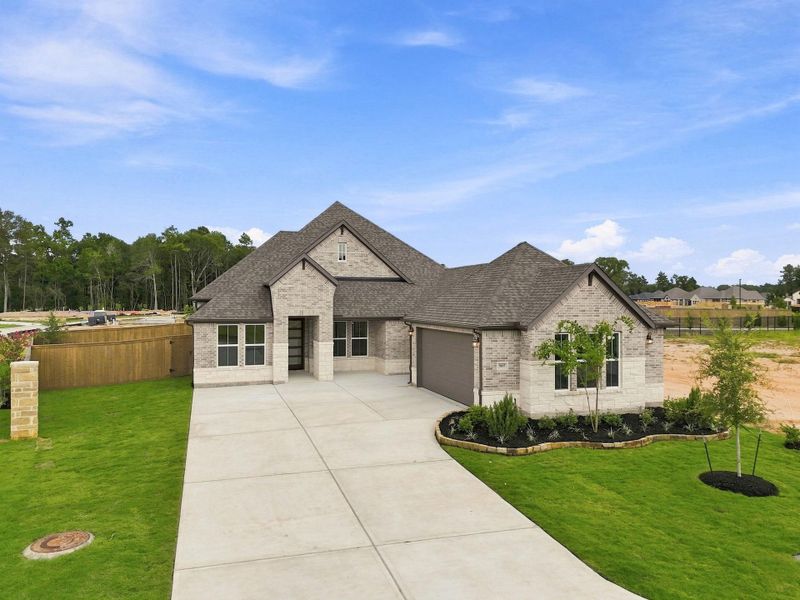 Front exterior of a new home in The Highlands, Porter, TX, highlighting curb appeal (Image 26).
