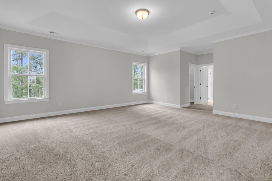 Spacious, unfurnished interior of a new home in Tidewater at Lakes of Cane Bay, Summerville (Image 50).