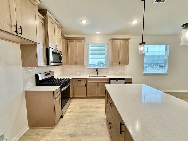 Furnished interior view inside a new home in Sage Hollow, Kyle (Image 7).