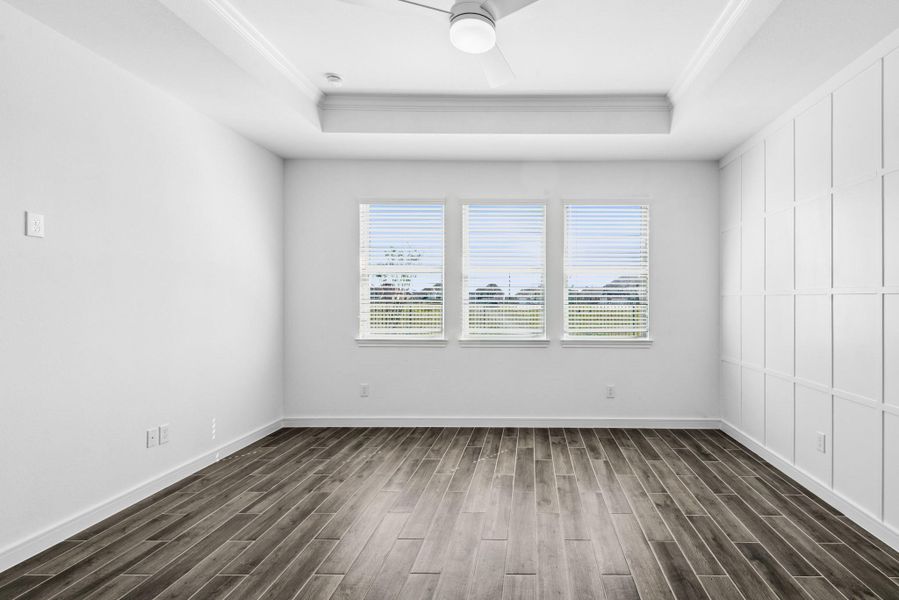 Spacious primary suite with feature wall Spacious primary suite with feature wall