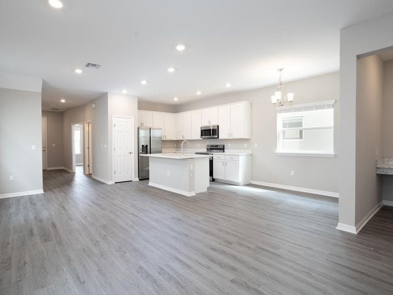 Your new bungalow offers a warm and welcoming living area - Capri home plan by Highland Homes Your new bungalow offers a warm and welcoming living area - Capri home plan by Highland Homes