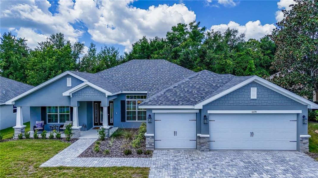 Front exterior of a new home in Juliette Falls, Dunnellon, FL, highlighting curb appeal (Image 1). Front exterior of a new home in Juliette Falls, Dunnellon, FL, highlighting curb appeal (Image 1).