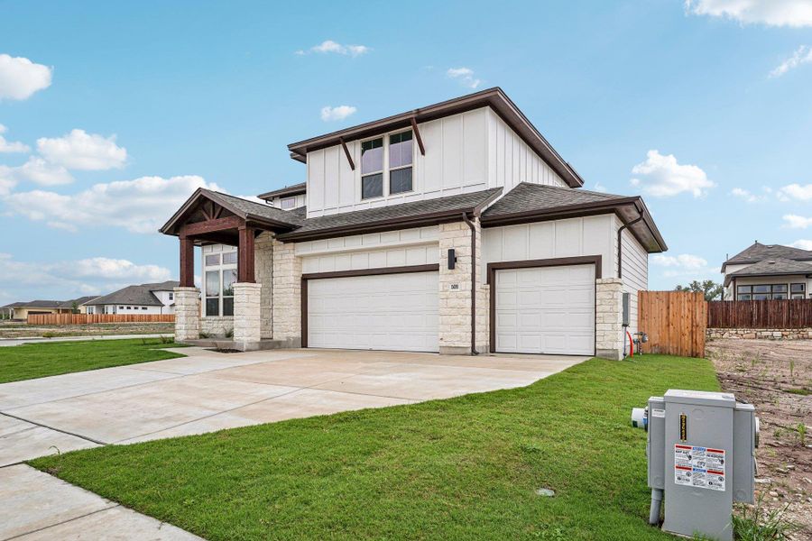 Front exterior of a new home in Sage Hollow, Kyle, TX, highlighting curb appeal (Image 2). Front exterior of a new home in Sage Hollow, Kyle, TX, highlighting curb appeal (Image 2).