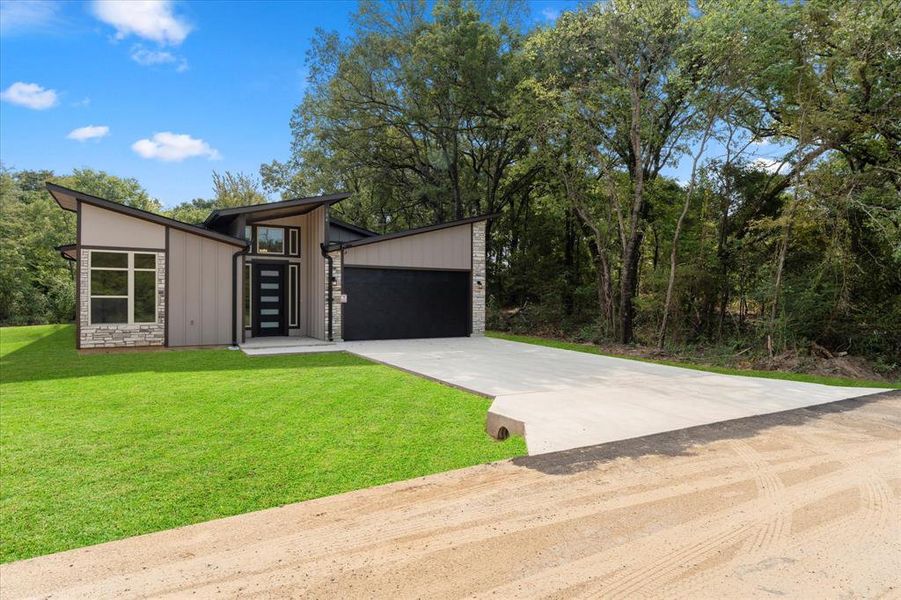 Front exterior of a new home in , Gun Barrel City, TX, highlighting curb appeal (Image 26). Front exterior of a new home in , Gun Barrel City, TX, highlighting curb appeal (Image 26).