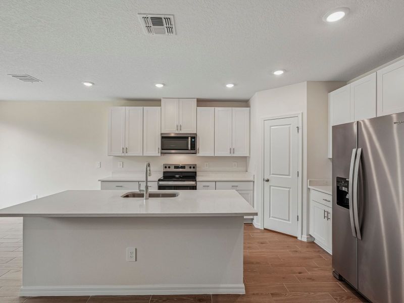 Furnished interior view inside a new home in Salt Meadows - Classic Series, Parrish (Image 6).