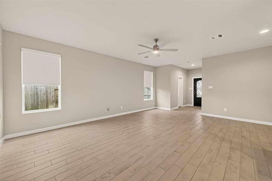 Another view of the spacious living room helps you imagine how you might arrange and personalize the space.